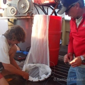 Crew member Steve and Tom rigging up a plankton net © Auckland Museum